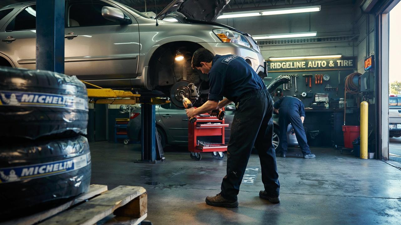 Mechanic changing a tire in a professional tire shop.
