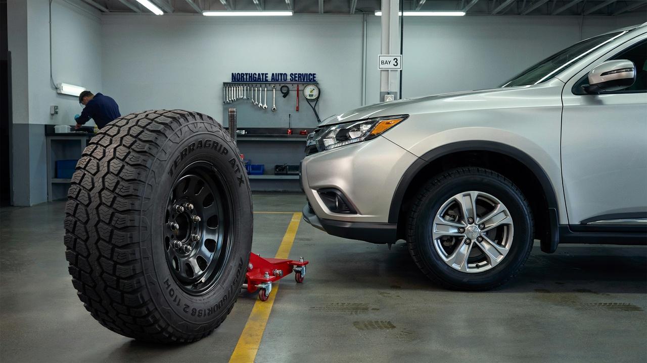 Full-size spare tire matching other tires installed on an SUV.